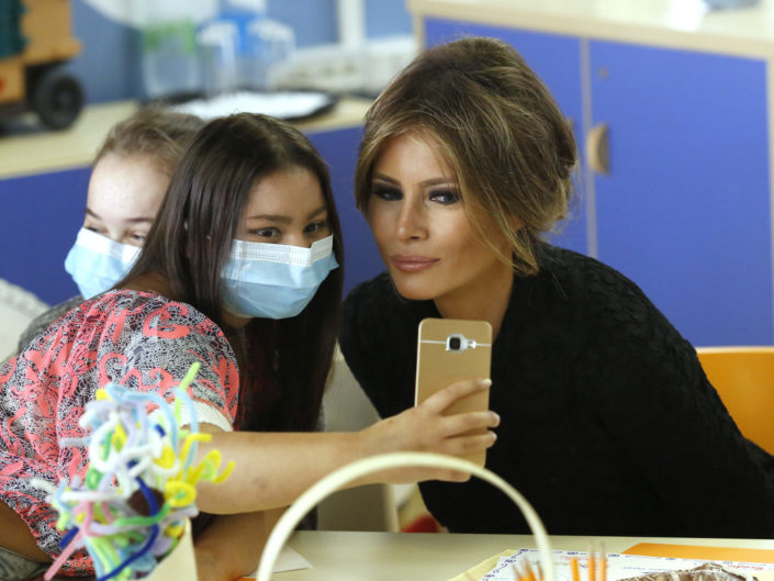 A girl takes a selfie with U.S. first lady Melania Trump at the Bambino Gesu hospital in Rome, Italy, May 24, 2017.