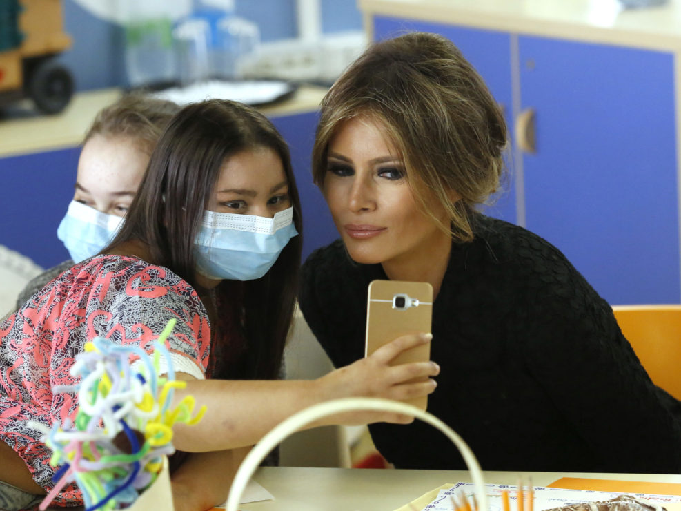 A girl takes a selfie with U.S. first lady Melania Trump at the Bambino Gesu hospital in Rome, Italy, May 24, 2017.
